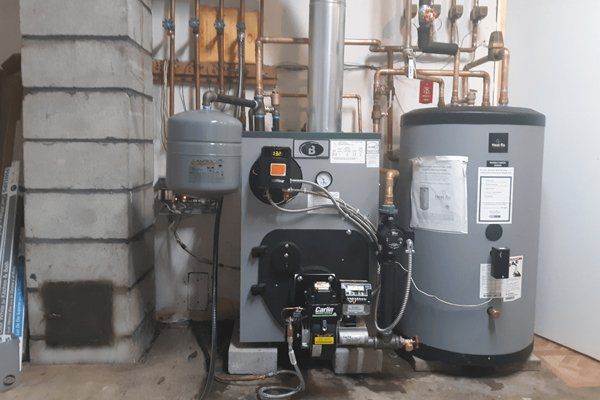 Modern Buderus boiler and Heat-Flo water heater installed by Gottier